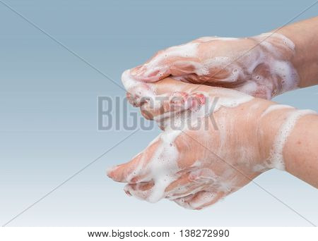 Hygiene concept. Woman is washing her hands.
