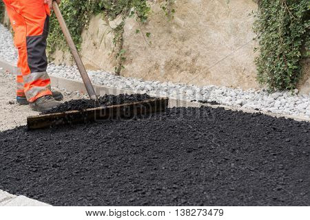 Construction workers paving a sidewalk - close up