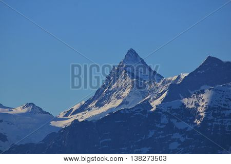 High mountain in the Swiss Alps. Mt Finsteraarhorn. Nature background.