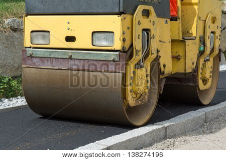 Sidewalks will be secured with road roller - closeup