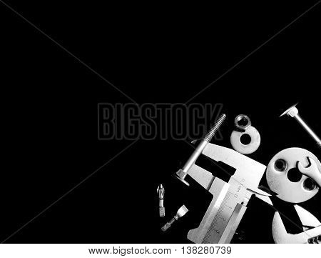 different instrument mechanic lying on a black background