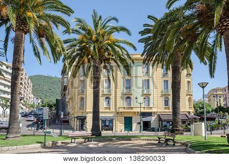 Ajaccio France - May 27 2016: View of one of the central streets of capital city of Corsica - Boulevard Albert 1er with palm trees and house number 10.