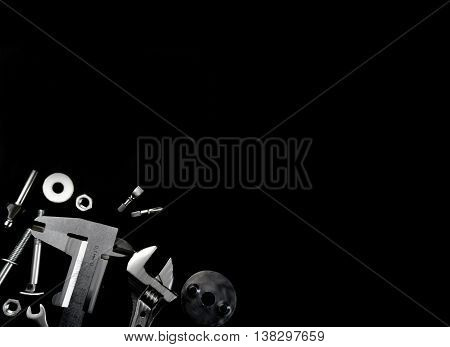 different instrument mechanic lying on a black background