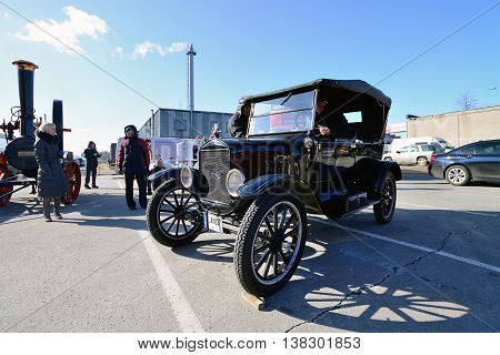 KAUNAS, LITHUANIA - MAR 23: Antique car show in a traditional flea market in second biggest Lithuanian city - Kaunas, on March 23, 2013 in Kaunas, Lithuania