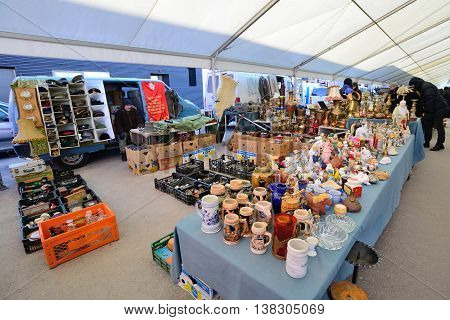 KAUNAS, LITHUANIA - MAR 23: Unidentified people in a traditional flea market in second biggest Lithuanian city - Kaunas, on March 23, 2013 in Kaunas, Lithuania
