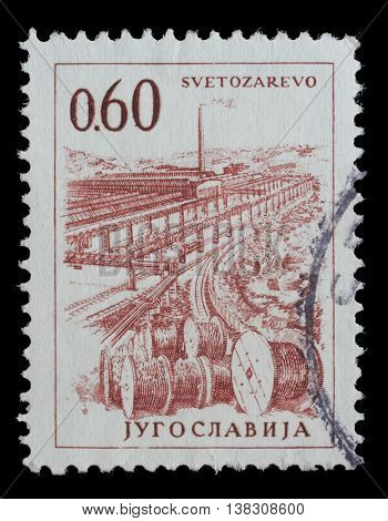 ZAGREB, CROATIA - JUNE 14: Stamp printed in Yugoslavia shows a Cable industry, Svetozarevo, with the same inscription, from series Industrial Progress, circa 1966, on June 14, 2014, Zagreb, Croatia
