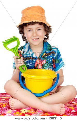 Adorable Boy Playing In The Beach
