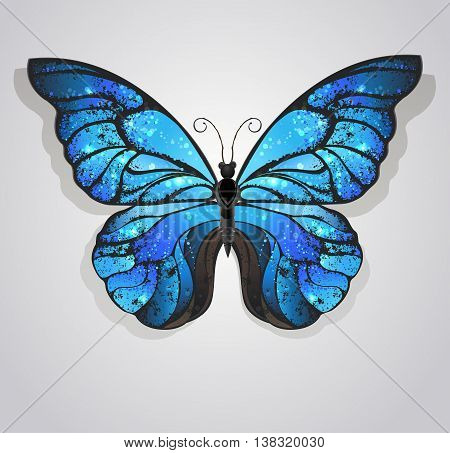 artistically painted blue butterfly morpho textured with iridescent wings on a light background.