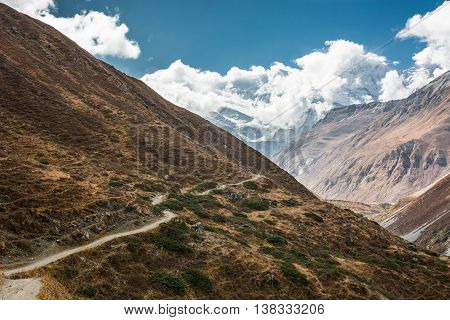 Mountain trail on a steep slope. Trekking is a nice way to enjoy Annapurna region in Nepal.