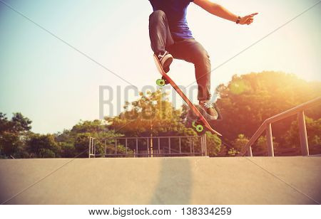 closeup of one skateboarder at skate park ramp