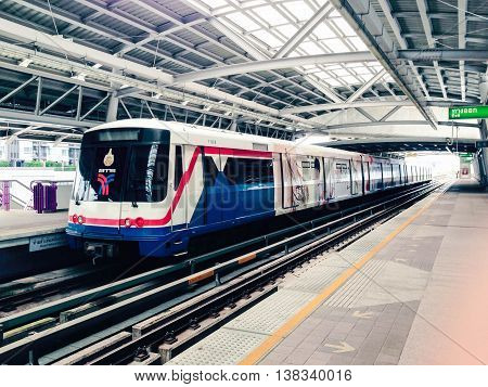 Sky train departs the platform in Bangkok, Thailand. Taken on June 26, 2017