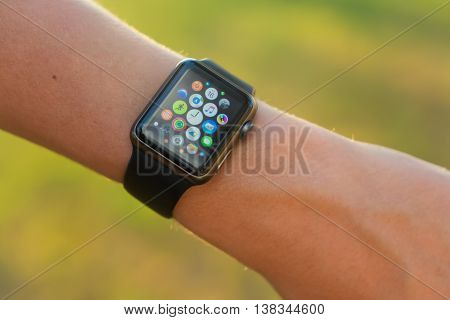 MIADEL, BELARUS - June 16, 2016: Someone using Apple Watch outside, multiple apps view,