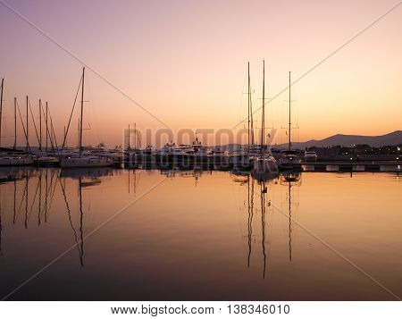Sunset in Marina. Yachts and pier at dusk.