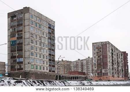 Multi-storey residential building in Norilsk. House on pile foundation, built on permafrost.