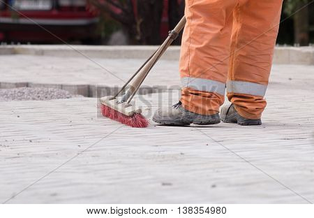 Construction Worker Sweeping