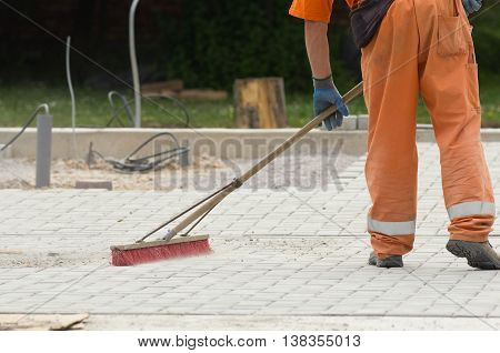 Construction Worker Sweeping