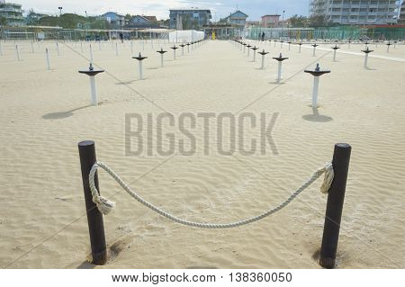 Cervia Italy 30th April 2016: empty beach umbrella sea panorama summer season