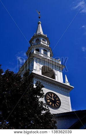 Fitzwilliam New Hampshire - July 11 2013: 1775 Original Meeting House with its wooden tiered steeple and-clock