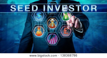 Male entrepreneur is touching SEED INVESTOR on a control monitor. Dollar sign pound sterling growth chart and people icons are lighting up in color. Business concept and venture capital metaphor.