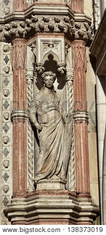 Fortitude virtue allegoric statue from Porta della Carta gothic gate in Saint Mark Square