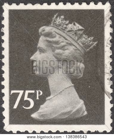 MOSCOW RUSSIA - JANUARY 2016: a post stamp printed in the UNITED KINDOM shows a portrait of Portrait of Queen Elizabeth II circa 1970 - 1977