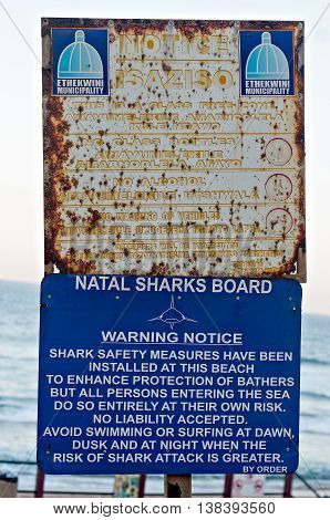 DURBAN SOUTH AFRICA - JULY 13 2016: Ethekwini Municipality notice and Natal Sharks Board Warning Notice on the promenade at Umhlanga Rocks