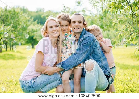 Portrait of young happy family at outdoos
