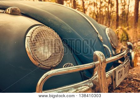 Vintage Car Volkswagen Retro Blue Color In Forest Leaves Brown