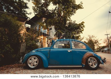 Vintage Car Volkswagen Retro Blue Color In Forest Leaves Brown
