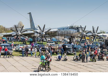 Kyiv Ukraine - April 26 2015: Strategic bomber Tu-95 Bear is in the State Museum of Aviation.People walk viewing the exhibits of the festival 