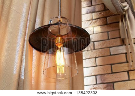 Edison's light bulb and lamp in modern style coffee shop. warm tone photo