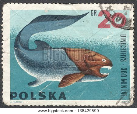 MOSCOW RUSSIA - CIRCA JANUARY 2016: a post stamp printed in POLAND shows an animal "Dinichthys" the series "Prehistoric Animals" circa 1966