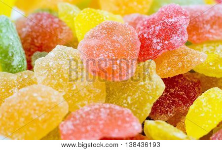 Very tasty colorful lollipops assorted background plates