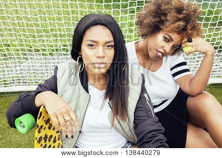 young pretty multi ethnicity afro-american girls having fun on foothball field, fan club of swag teenagers, lifestyle people concept