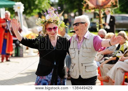Orel Russia - July 08 2016: Russian Valentine Day - Petr and Fevronia. Senior couple in sunglasses smiling and hugging