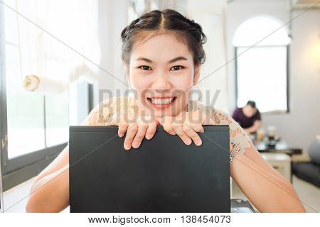 Freelance E Business Asian Women Using Laptop Computer In Coffee Shop