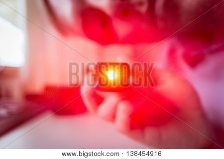Bright Red Point Light from Looking into Shining Laser