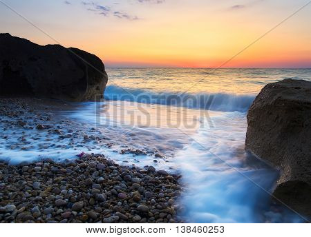 Sea shore during gold sunrise. Beautiful natural seascape