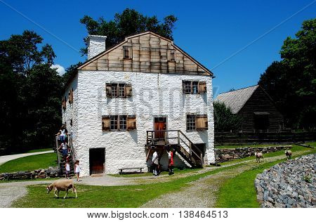 Sleepy Hollow NY - July 9 2009: Sheep walk on the pathways in front of the manor house built by Frederick Philipse at c. 1750 Philipsburg Manor