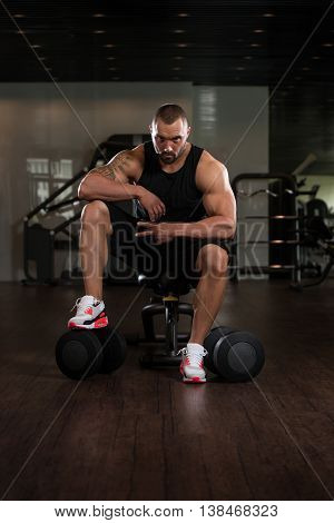 Bodybuilder Resting At The Bench