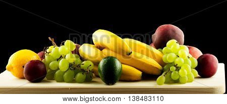 Fresh fruits isolated on black backgtound. Healthy food