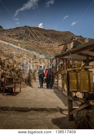 Kora Prayer wheels installed in Tibetan temple.