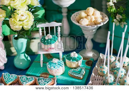 Candy bar on wedding ceremony with a lot of different candies and beverages.