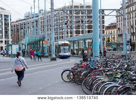 Geneva Switzerland - June 17 2016: The city tram and bicycles on street in Geneva