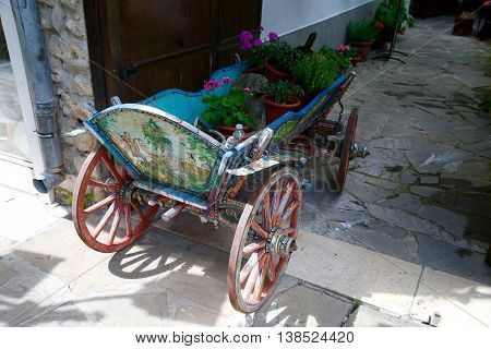 Old wagon with flowers raritet history Nesebar. Bulgaria.