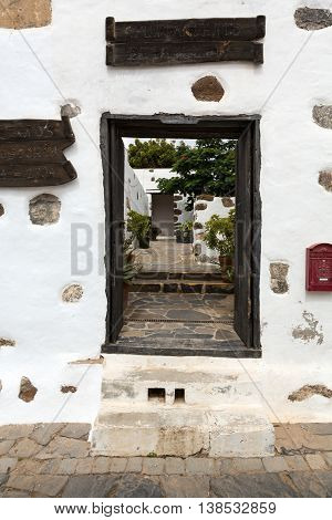 BETANCURIA, SPAIN - SEPTEMBER 16, 2015: Old black entrance gate in Betancuria village on on Fuerteventura Canary Islands Spain