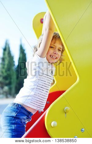a sweet happy girl on the playground
