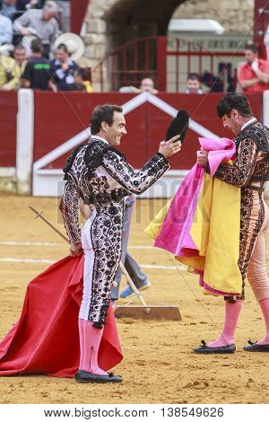 Ubeda Spain - October 4 2011: The Spanish Bullfighter El Cid greeting the public with its cap in the hand in gratitude to its bullfight in the Bullring of Ubeda Spain