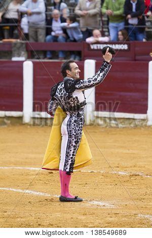 Ubeda Spain - October 4 2010: The Spanish Bullfighter El Cid greeting the public with its cap in the hand in gratitude to its bullfight in the Bullring of Ubeda Spain