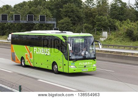 FRANKFURT GERMANY - JULY 12 2016: Green Flixbus european long distance coach on the highway in Germany